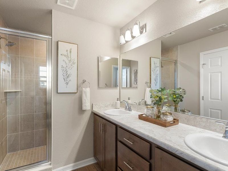 Your suite is complete with a large walk-in wardrobe and en-suite bath - Mariposa townhome by Highland Homes Your suite is complete with a large walk-in wardrobe and en-suite bath - Mariposa townhome by Highland Homes