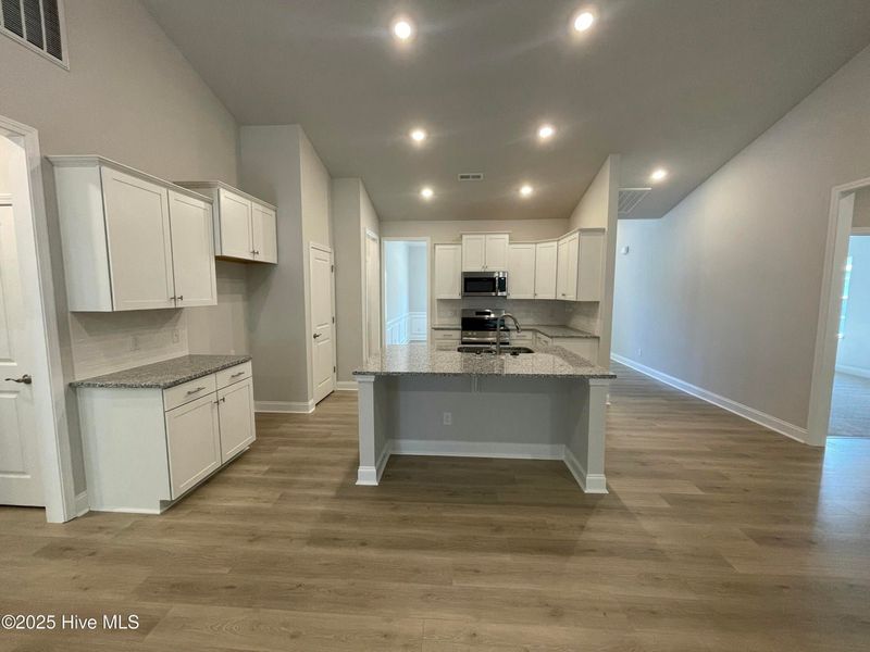 Furnished interior view inside a new home in Mill Creek Cove, Bolivia (Image 6).