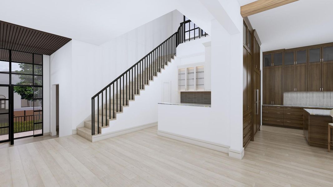 Fourteen foot ceilings greet you at the front door into an entry space offering access to the study with full bath. The wood ceiling flows seamlessly between the outside porch and the entry offering the illusion of bringing the outside in.