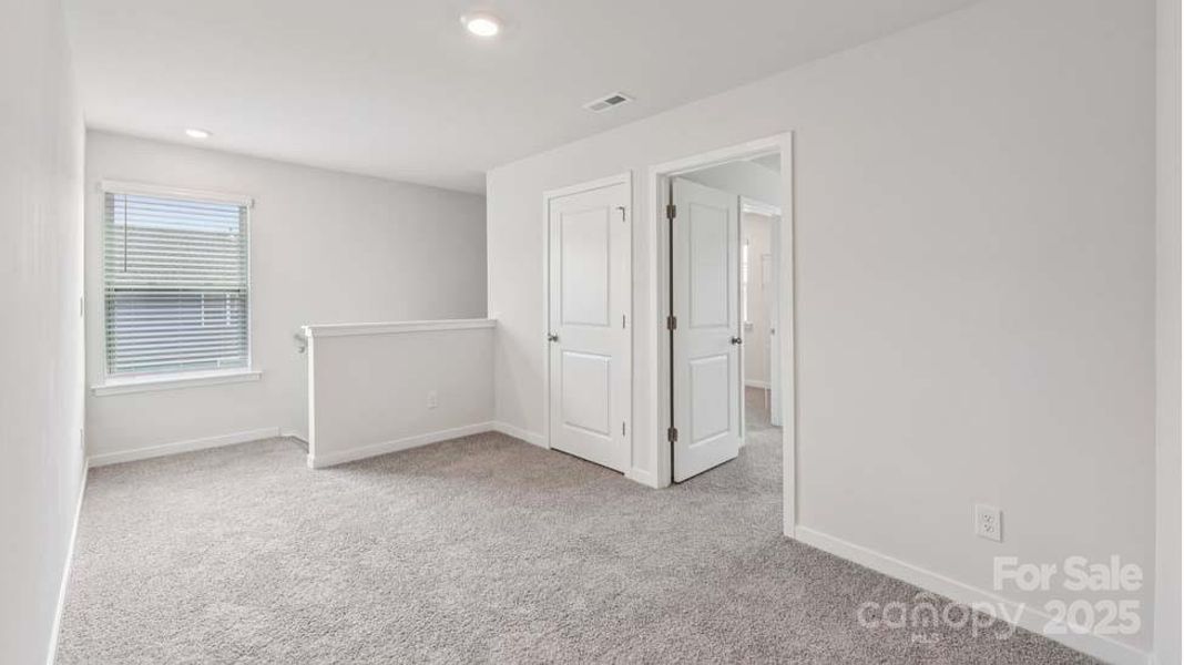 Spacious, unfurnished interior of a new home in Cardinal Creek, Charlotte (Image 22).