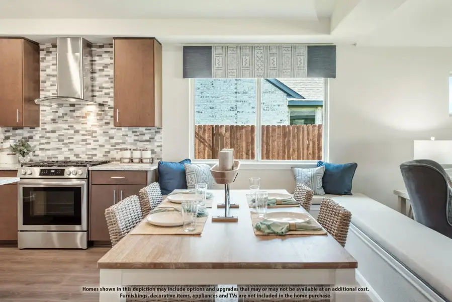 Kitchen and dining area with stainless steel range, tile backsplash, wood cabinets, and built-in bench seating by a window.