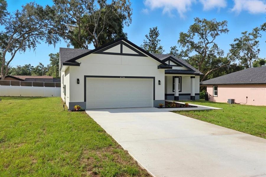 Front exterior of a new home in , Inverness, FL, highlighting curb appeal (Image 21).