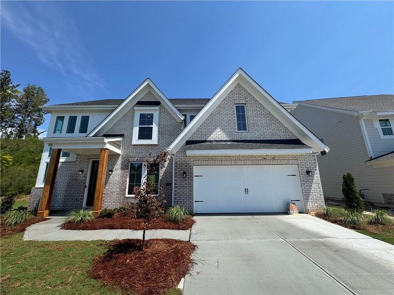 Front exterior of a new home in Twin Lakes, Hoschton, GA, highlighting curb appeal (Image 2).