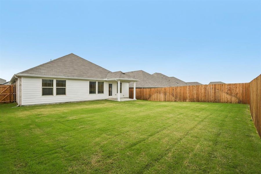 Exterior details and patio area of a home in Simpson Crossing - Signature Series, McKinney (Image 20). Exterior details and patio area of a home in Simpson Crossing - Signature Series, McKinney (Image 20).