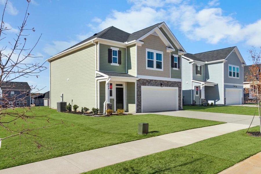 Front exterior of a new home in Windsor, North Augusta, SC, highlighting curb appeal (Image 22). Front exterior of a new home in Windsor, North Augusta, SC, highlighting curb appeal (Image 22).