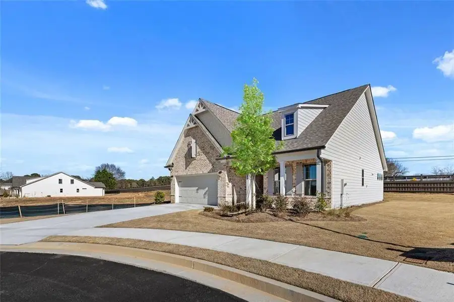 Front exterior of a new home in Soleil Summit Chase, Snellville, GA, highlighting curb appeal (Image 2).