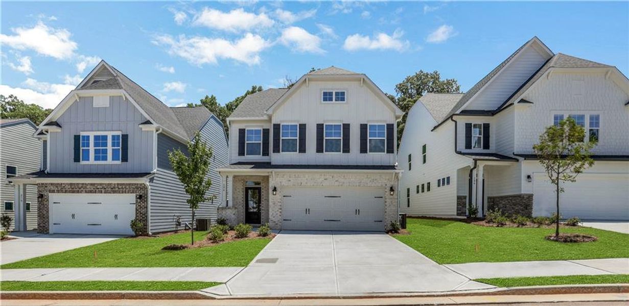 Front exterior of a new home in Villas at Dawsonville, Dawsonville, GA, highlighting curb appeal (Image 19). Front exterior of a new home in Villas at Dawsonville, Dawsonville, GA, highlighting curb appeal (Image 19).