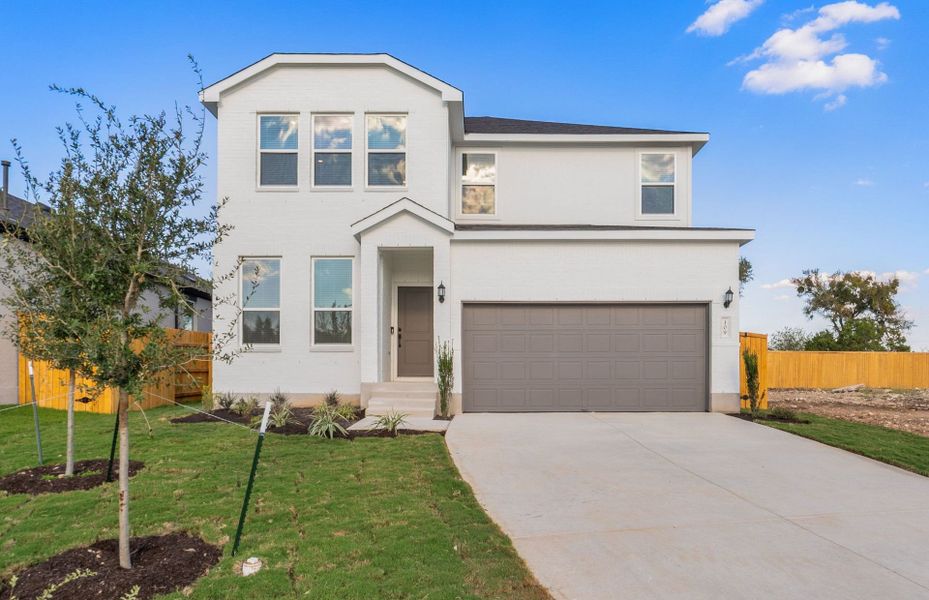 Front exterior of a new home in Woodside, Georgetown, TX, highlighting curb appeal (Image 21).