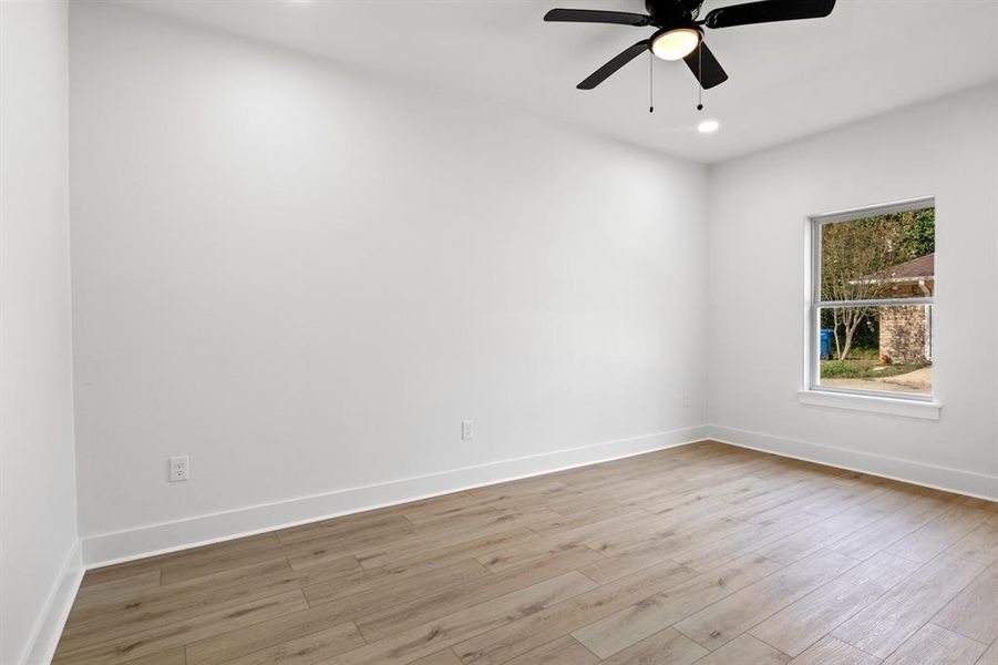 Empty room featuring light wood finished floors, recessed lighting, and ceiling fan