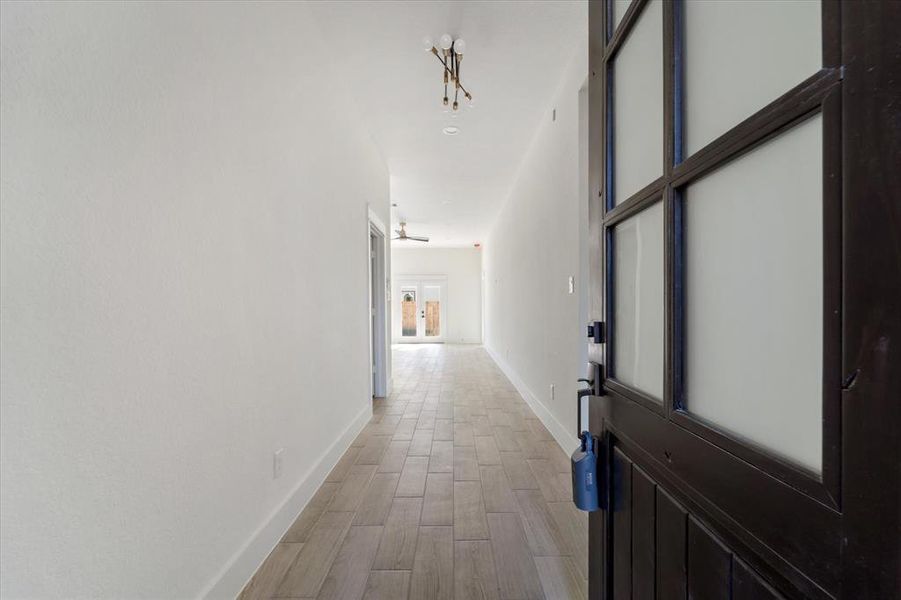 Step inside to find a spacious foyer. To the left, a door leads to the  half bath & garage, while to the right, a door opens to your first two bedrooms.