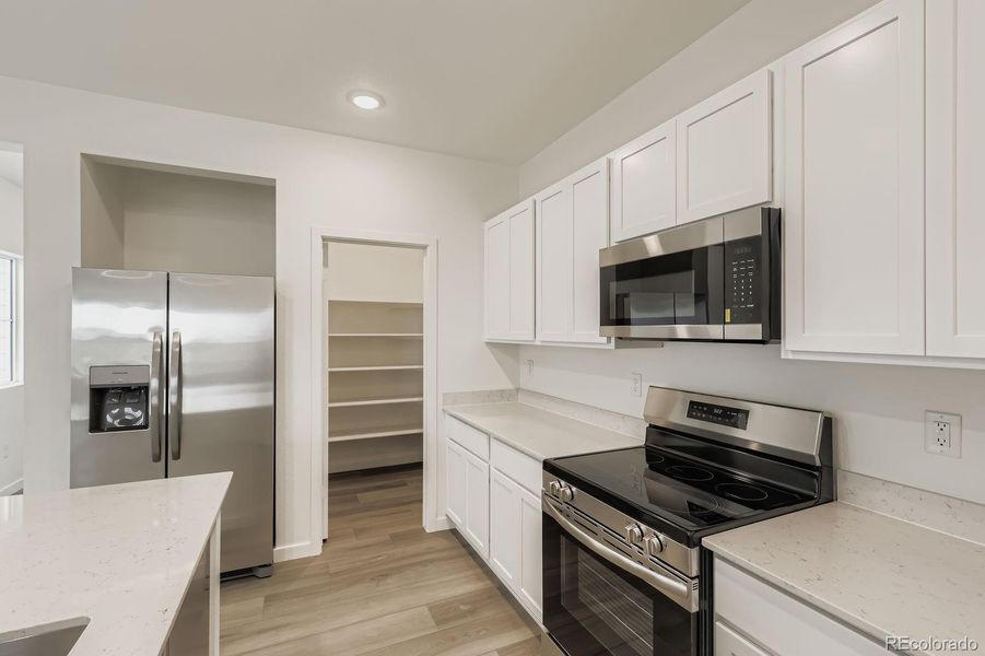 Furnished interior view inside a new home in Eastcreek Farm: Paired Homes, Thornton (Image 7).