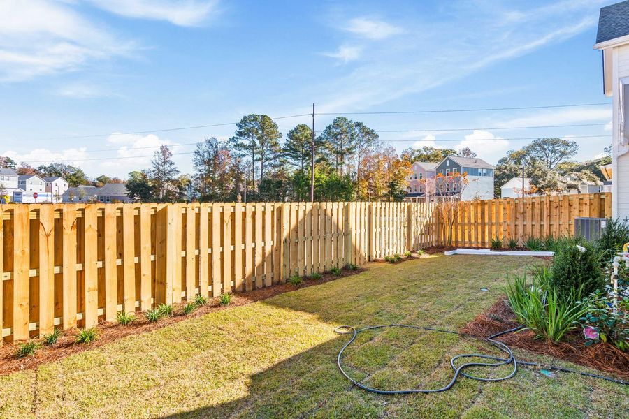 Exterior details and patio area of a home in , Johns Island (Image 32).