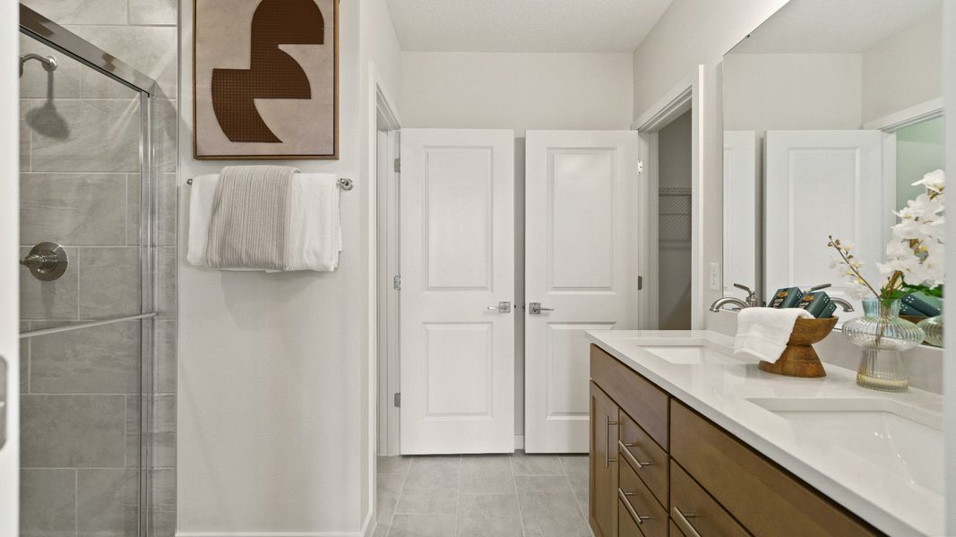 Castaway Model Home Primary Suite, en suite bath with dual sinks new home plan available at Liberty Trace in Haines City, fl