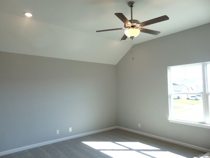 A bonus room which can be used as an extra bedroom, office, or game room. It has large windows, and a closet to store.