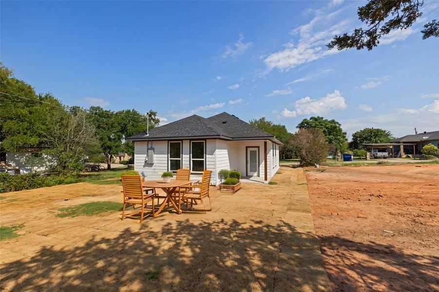 Back of house with a patio