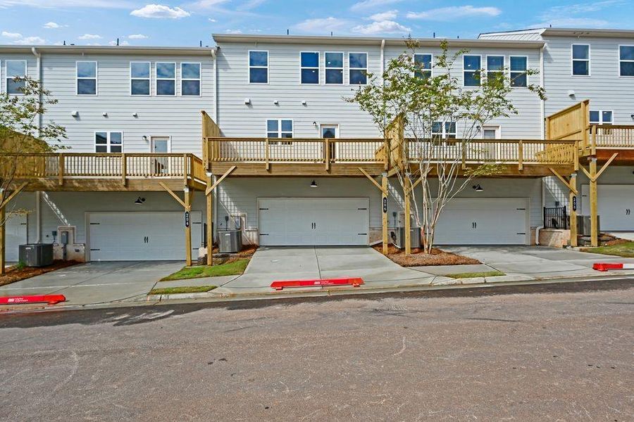 Front exterior of a new home in Chandler Run, Tucker, GA, highlighting curb appeal (Image 19). Front exterior of a new home in Chandler Run, Tucker, GA, highlighting curb appeal (Image 19).