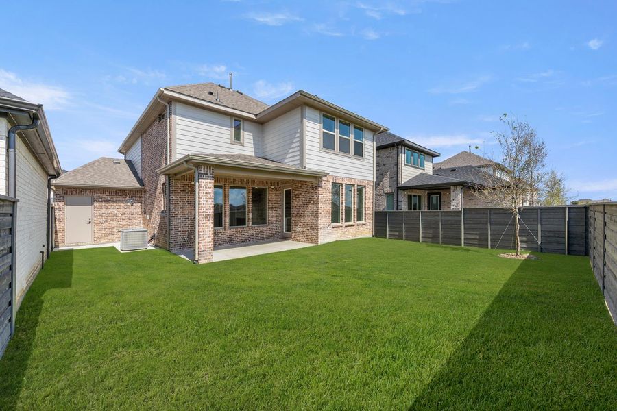 Exterior details and patio area of a home in Garden Collection at Union Park, Little Elm (Image 17).