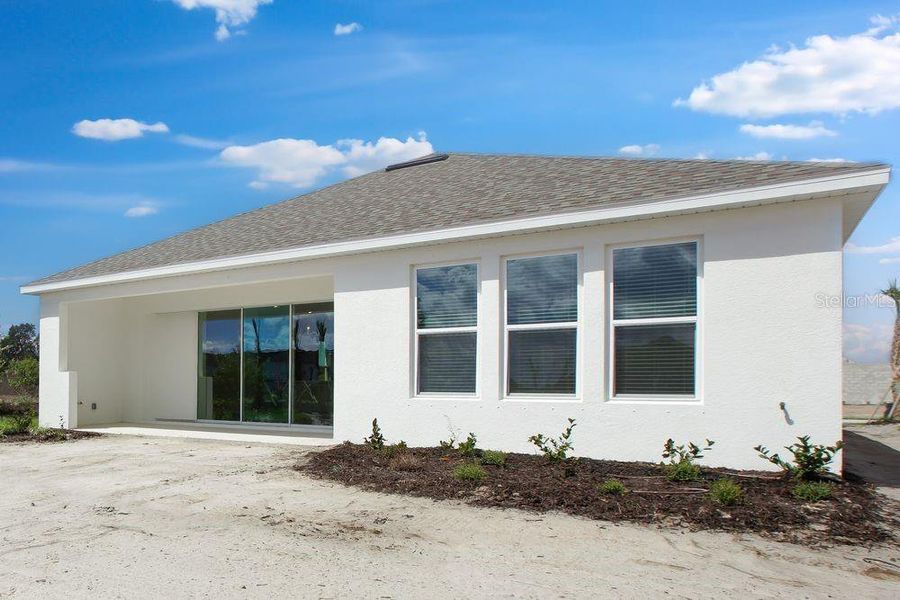 Exterior details and patio area of a home in Firethorn, Parrish (Image 25).