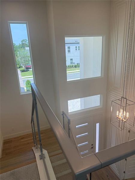 Foyer Windows and Staircase with Glass Railings