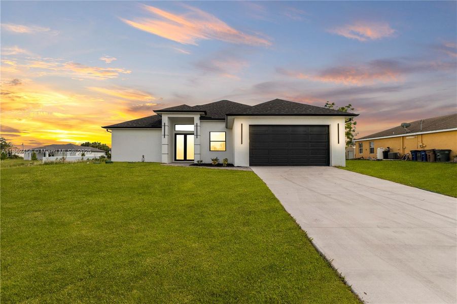 Front exterior of a new home in , Lehigh Acres, FL, highlighting curb appeal (Image 2). Front exterior of a new home in , Lehigh Acres, FL, highlighting curb appeal (Image 2).