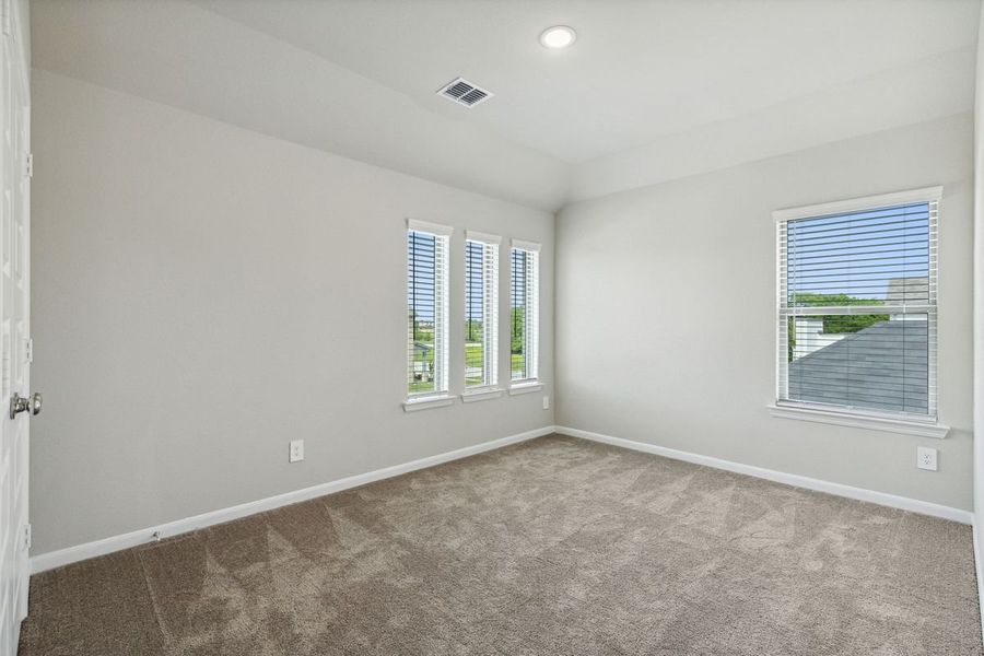 Bedroom in the Pearl home plan by Trophy Signature Homes – REPRESENTATIVE PHOTO