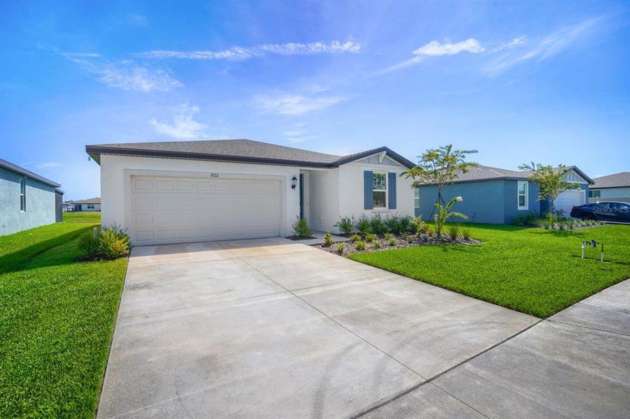 Front exterior of a new home in Salt Meadows - Classic Series, Parrish, FL, highlighting curb appeal (Image 21).