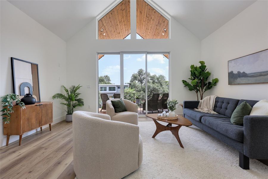 Living space featuring LARGE sliding glass windows that lead to the covered deck. Living space featuring LARGE sliding glass windows that lead to the covered deck.