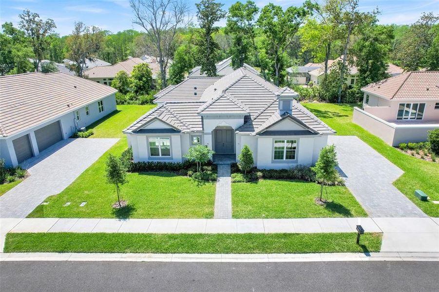 Front exterior of a new home in Toscana, Palm Coast, FL, highlighting curb appeal (Image 27). Front exterior of a new home in Toscana, Palm Coast, FL, highlighting curb appeal (Image 27).