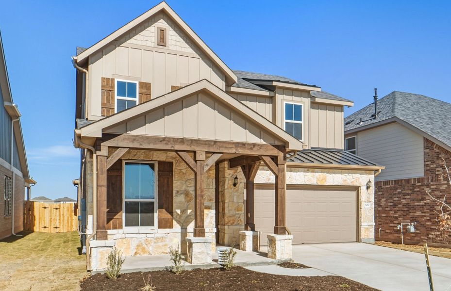 Front exterior of a new home in Sunfield, Buda, TX, highlighting curb appeal (Image 19).