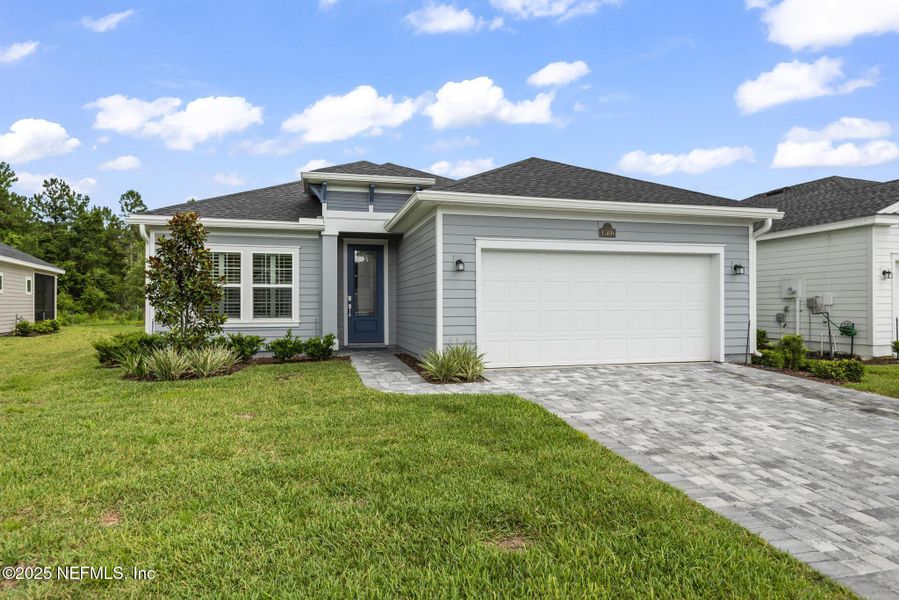 Front exterior of a new home in Stillwater | Active Adult 55+: Stillwater (50s) - Royal Collection, St. Johns, FL, highlighting curb appeal (Image 20). Front exterior of a new home in Stillwater | Active Adult 55+: Stillwater (50s) - Royal Collection, St. Johns, FL, highlighting curb appeal (Image 20).