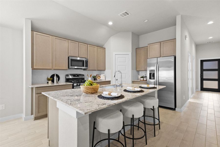 This eat-in kitchen offers plenty of room to gather, anchored by a large center island with granite countertops and seating for three. Stainless steel appliances, light wood cabinetry, and a subway tile backsplash come together for a clean, timeless look, while the open layout flows easily into the surrounding living spaces. It's a space made for cooking, casual meals, and everyday connection. This eat-in kitchen offers plenty of room to gather, anchored by a large center island with granite countertops and seating for three. Stainless steel appliances, light wood cabinetry, and a subway tile backsplash come together for a clean, timeless look, while the open layout flows easily into the surrounding living spaces. It's a space made for cooking, casual meals, and everyday connection.