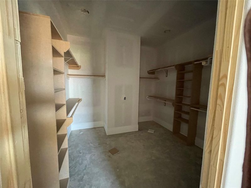 Primary bedroom walk-in closet with lots of space and shelving! Primary bedroom walk-in closet with lots of space and shelving!
