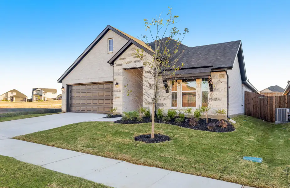 Front exterior of a new home in Elevon, Lavon, TX, highlighting curb appeal (Image 2). Front exterior of a new home in Elevon, Lavon, TX, highlighting curb appeal (Image 2).