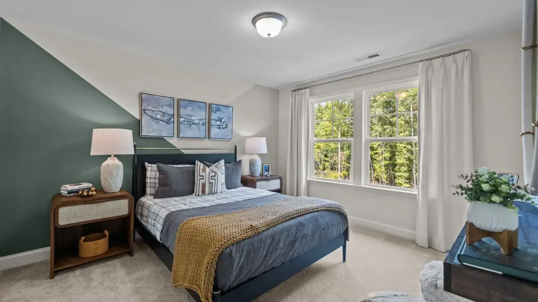 Ample secondary bedroom with elevated ceiling and large windows, in the Townsend Design by DRB Homes in York, SC Ample secondary bedroom with elevated ceiling and large windows, in the Townsend Design by DRB Homes in York, SC