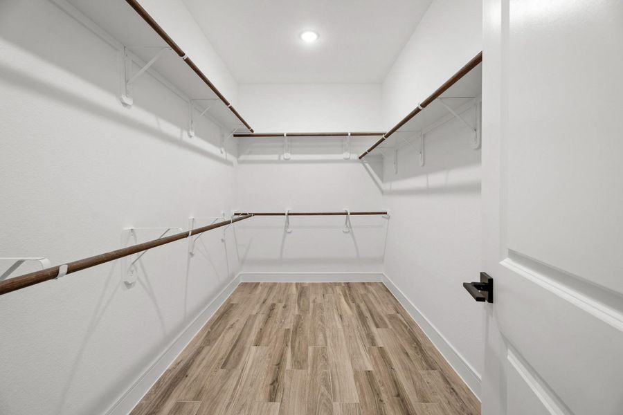 Walk-in closet in the primary suite (*Photo not of actual home and used for illustration purposes only.) Walk-in closet in the primary suite (*Photo not of actual home and used for illustration purposes only.)