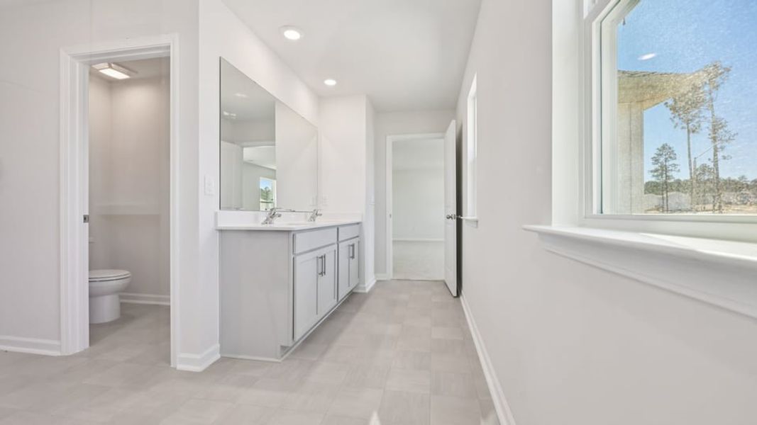 Furnished interior view inside a new home in Gretchen Pines, West End (Image 7).