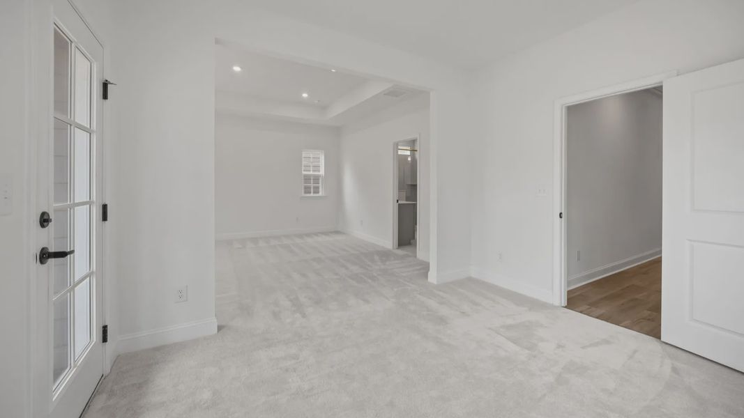 The Brentwood Plan by DRB Homes in River District, Charlotte NC.- Primary Bedroom with Sitting Area The Brentwood Plan by DRB Homes in River District, Charlotte NC.- Primary Bedroom with Sitting Area