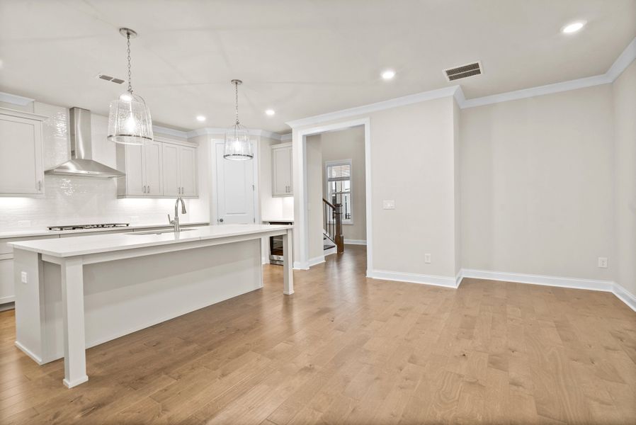 Representative furnished interior of a home built from the The McIntosh by The Providence Group in Promenade at Sawnee Village, Cumming (Image 6).