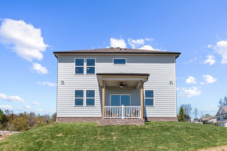 A house with a grass yard. A house with a grass yard.