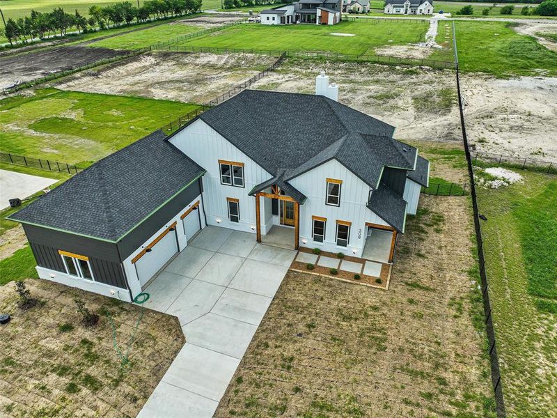 Front exterior of a new home in , Gunter, TX, highlighting curb appeal (Image 2).