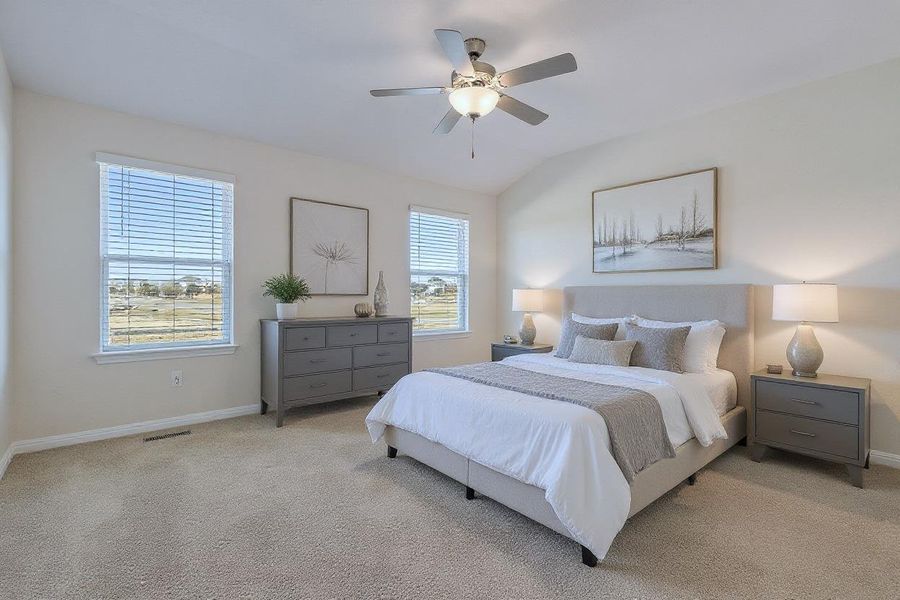 Virtually Staged: Master Bedroom Carpeted with a ceiling fan and vaulted ceiling Virtually Staged: Master Bedroom Carpeted with a ceiling fan and vaulted ceiling