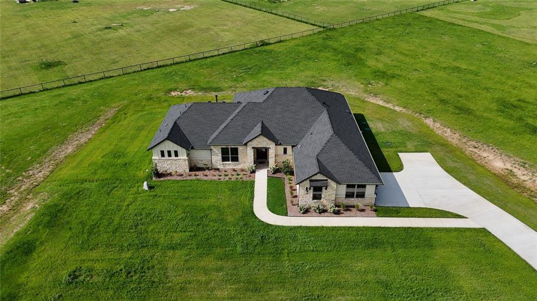 Front exterior of a new home in , Poolville, TX, highlighting curb appeal (Image 20). Front exterior of a new home in , Poolville, TX, highlighting curb appeal (Image 20).