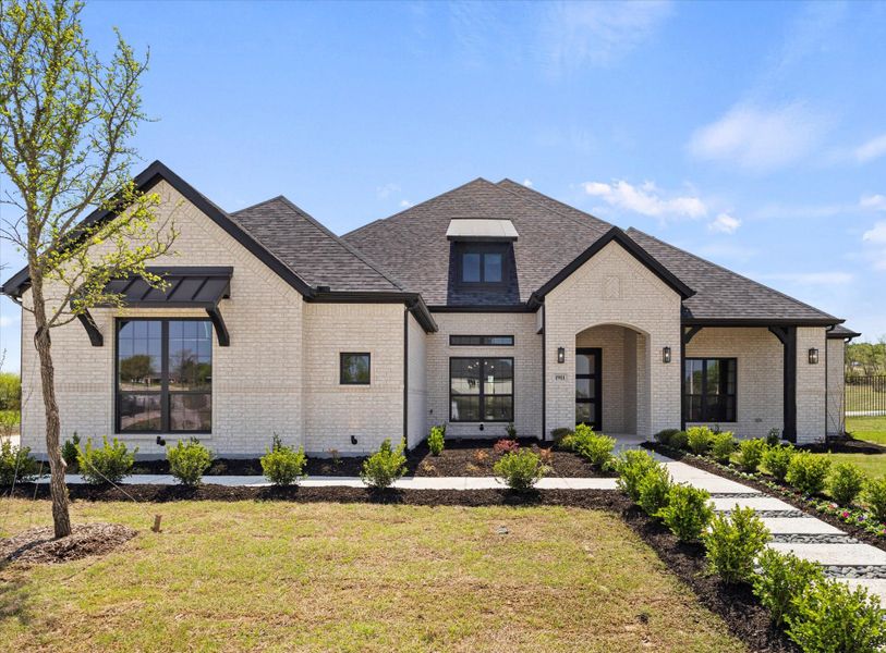 Front exterior of a home in the Winding Creek community, located in Rockwall, TX (Image 8).
