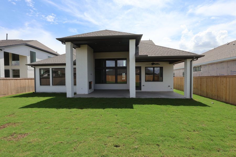 Exterior details and patio area of a home in Prairieland Village - Summit Collection, Cypress (Image 3).