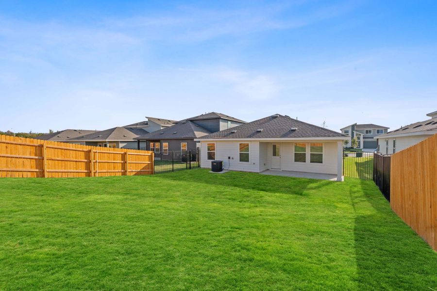 Back of house with a patio and a fenced backyard
