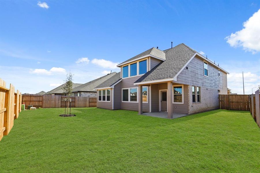 Spacious backyard with covered patio