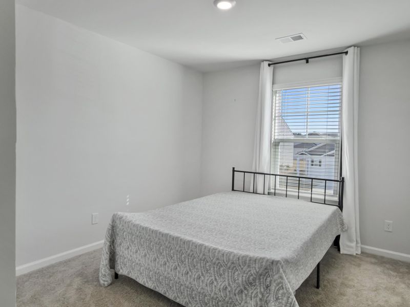 Furnished interior view inside a new home in Pine Hills at Cane Bay, Summerville (Image 15). Furnished interior view inside a new home in Pine Hills at Cane Bay, Summerville (Image 15).