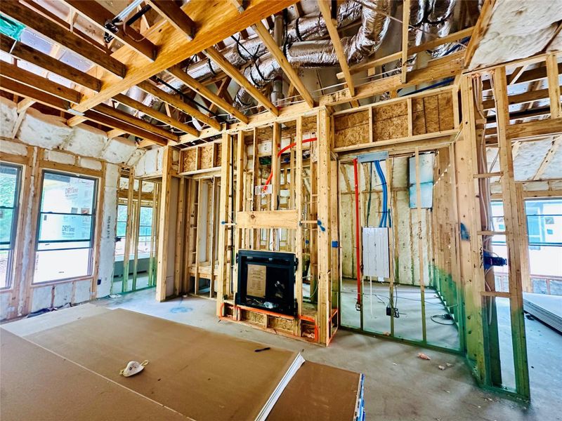 Family Room with fireplace & elevated ceiling