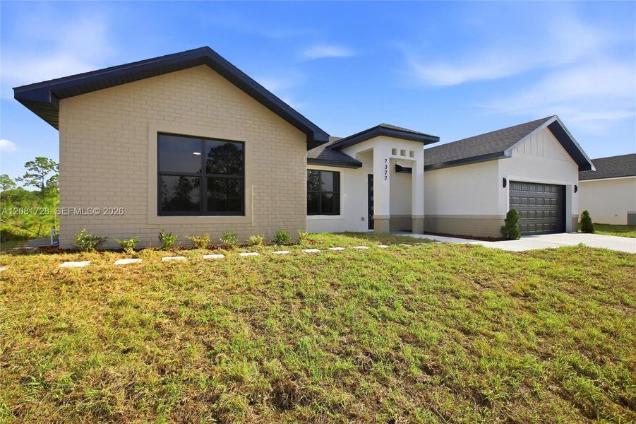 Front exterior of a new home in , Sebring, FL, highlighting curb appeal (Image 2). Front exterior of a new home in , Sebring, FL, highlighting curb appeal (Image 2).