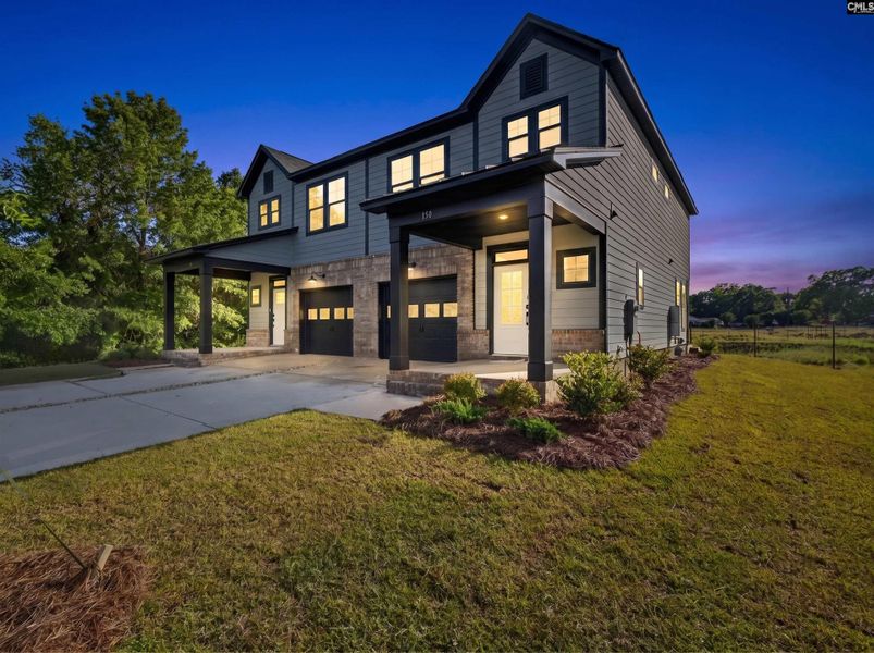Front exterior of a new home in Dunbar Village, Cayce, SC, highlighting curb appeal (Image 22).